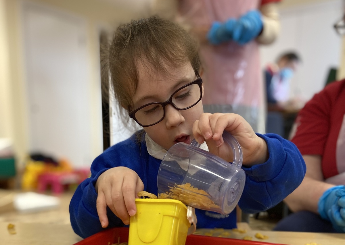 Little girl enjoys messy play